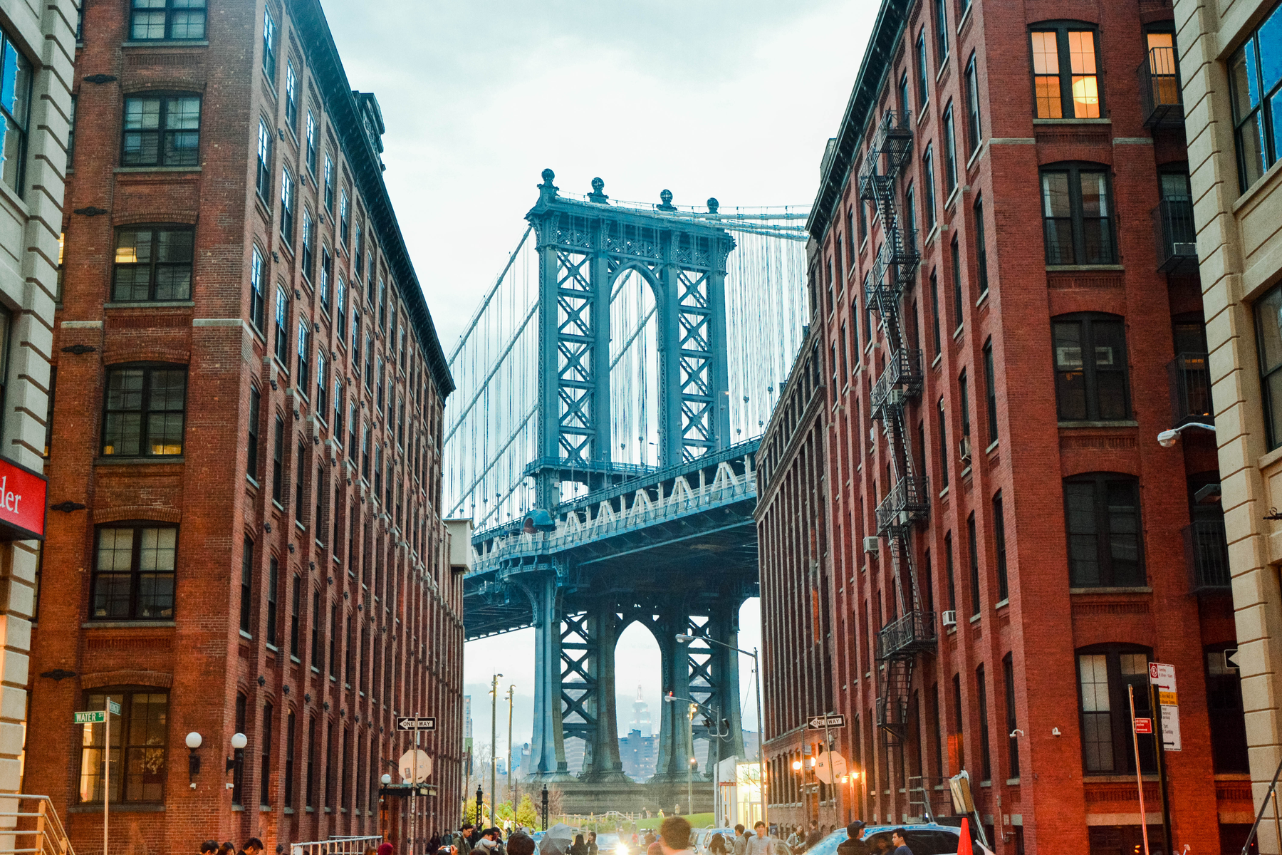 Manhattan Bridge framed by brick buildings on Washington Street in DUMBO